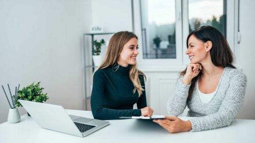 Two female entrepreneurs smiling