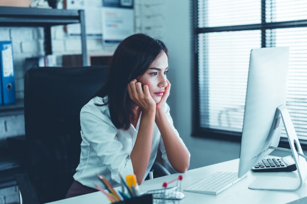 a woman looking into a computer