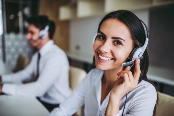 a woman talking to a customer 