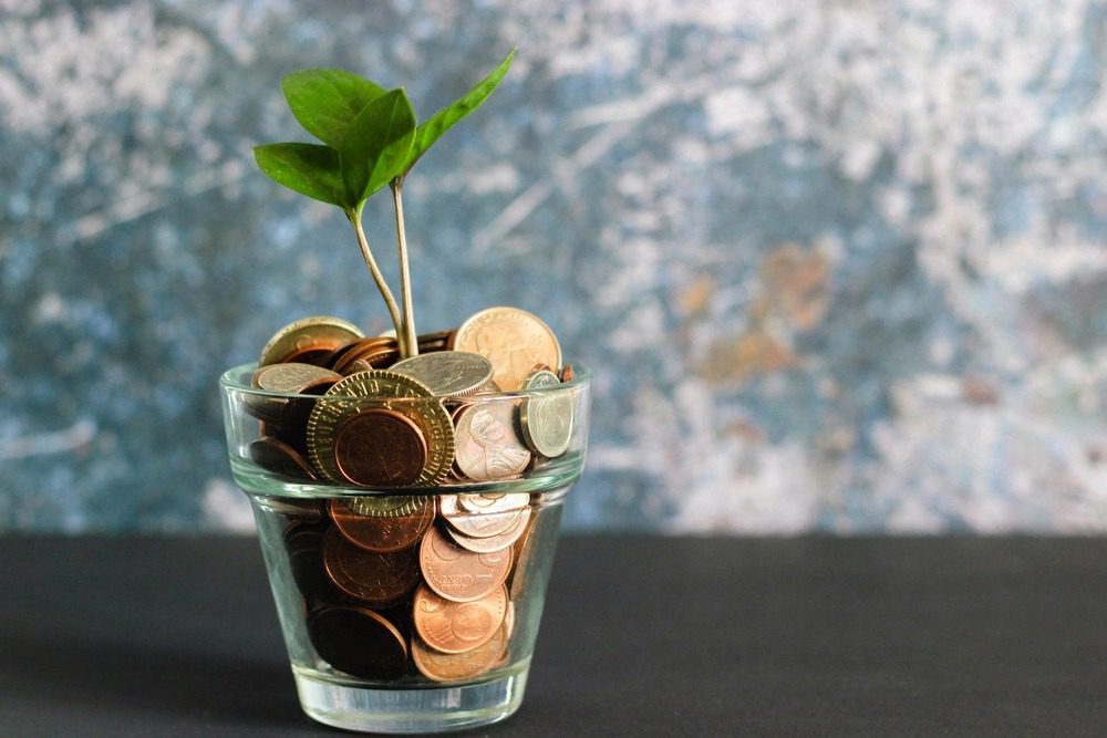 coins in a glass pot 