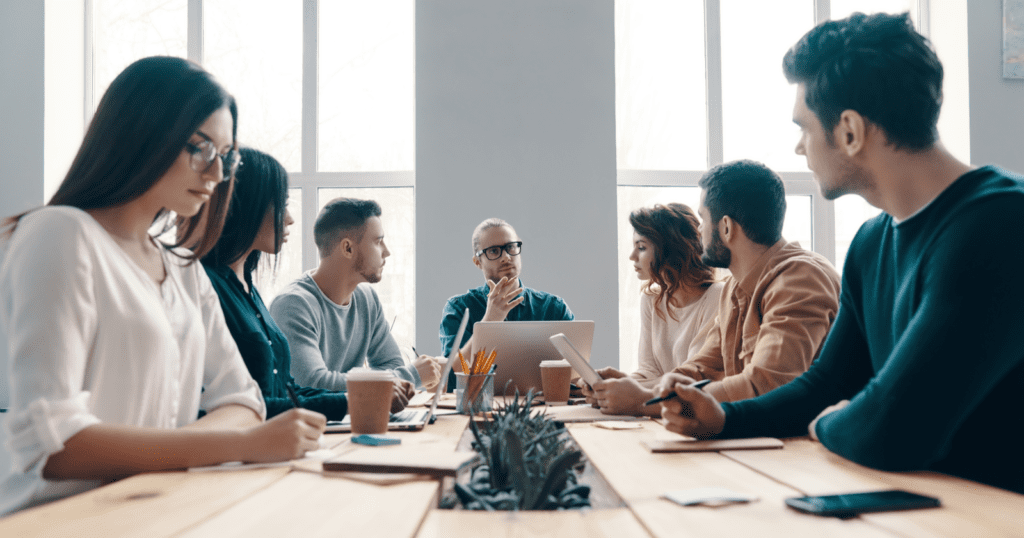 flawless business solutions - a group of people sitting together. 